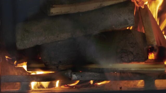 Fire burning in the fireplace. Dynamic rollover