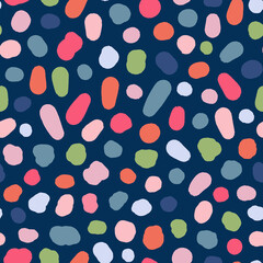 Multicolored, irregular polka dots seamless repeat pattern. Random placed, vector stains all over surface print on blue background.
