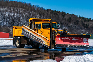 Yellow Plow Truck In Snow