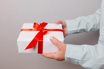 Close up shot of woman holding a beautiful gift box, female gift, christmas holidays and greeting season concept