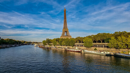 A beautiful shot of the Seine river in the background of the Eiffel Tower.