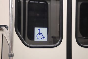 Disability sign on the door of a subway car