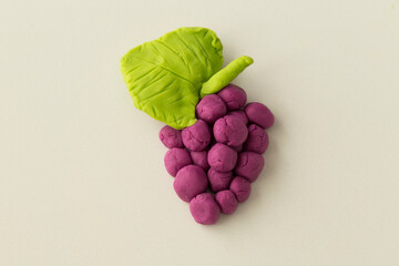 Making grape game step by step with dough for children's activity in the school art lesson and...