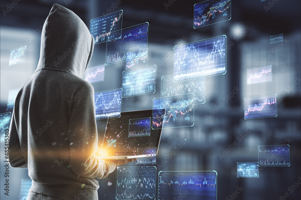 Poster hacker in hoodie using laptop with various forex screens on blurry office interior background. crypt