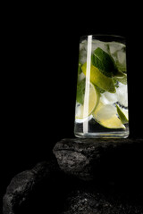 mojito cocktail with lime on a black background