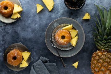 top down view of servings of pineapple upside down cakes with pineapple slices.