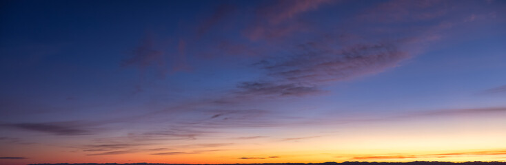 Beautiful Panoramic View of colorful cloudscape with blue Sky in Background during a sunny winter sunset. Taken in Vancouver, British Columbia, Canada.