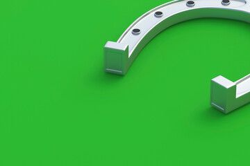 Silver horseshoe on a green background. Symbol of luck. Successful concept. Copy space. 3d render