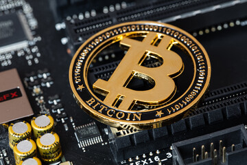 Bitcoin on computer motherboard background
