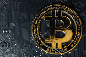 Bitcoin on computer motherboard background