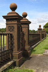 Fototapeta na wymiar Ornate wrought iron railings surrounding heritage-listed Centennial Park Reservoir 1 on Oxford Street, Centennial Park, New South Wales, Australia.