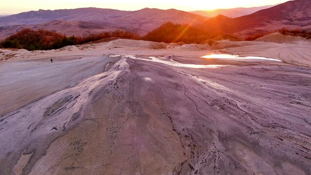Aerial footage from drone with muddy volcano from Romanian mountains , Buzau county , Carpathian mountains , aerial landscape ,Paclele mici and Paclele Mari , vulcanii noroiosi 