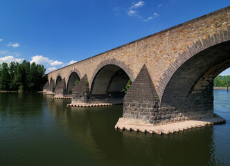 Fototapeta premium UNESCO Heritage Balduin Bridge On Mosel River Germany On A Beautiful Sunny Summer Day With A Clear Blue Sky And A Few Clouds
