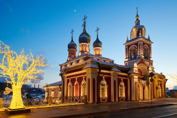 Fototapeta na wymiar Russia. Winter Moscow. Evening illumination of St. George's Church on Varvarka Street