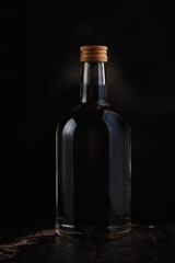 A bottle of vodka on a dark background