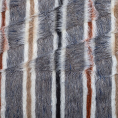 Specially woven rugs made from animal fur. carpets or rugs with different textures and colors