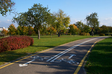 path with markings in the park sunny weather bicycle sign footpath