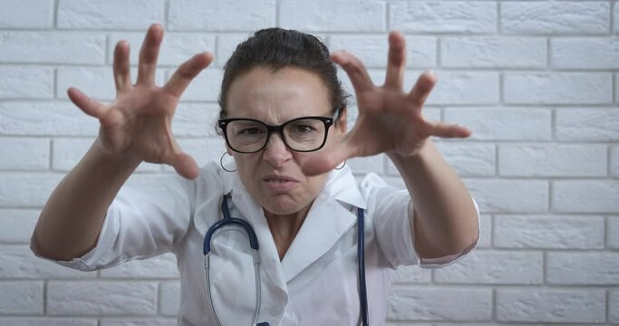 Exhausted day at clinic. An exhausted doctor tro to scared somebody in the room.