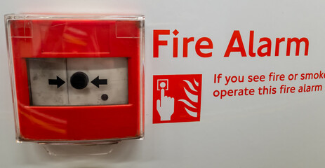 A fire alarm with instructions to operate in case of fire emergency.