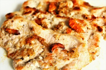 Grilled slices pork with red chili pepper. close up photo top view 