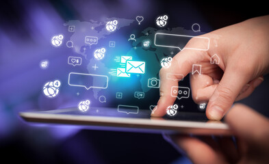 Close-up of a hand using tablet, social media concept