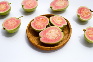Fresh pink guava on white background.