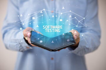 Businessman holding a foldable smartphone, new technology concept