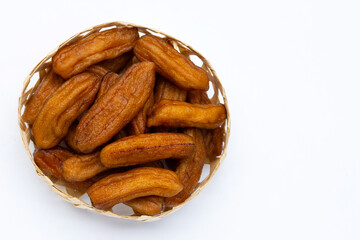 Sun-dried bananas on white background.