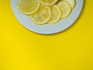Sliced ​​lemon on a white background. Citrus slices on the table. Bright background. Healthy...