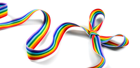 Colorful rainbow ribbon bow. LGBT colourful corner design, isolated on white background. Gay pride design. Ribbon or banner with flag of LGBTQ pride border. Gift