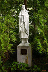 Statue of Saint Kateri Tekakwitha on the grounds of the Franciscan Monastery, Kennebunk, Maine - obrazy, fototapety, plakaty
