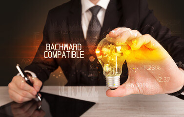 Businessman holding a lightbulb