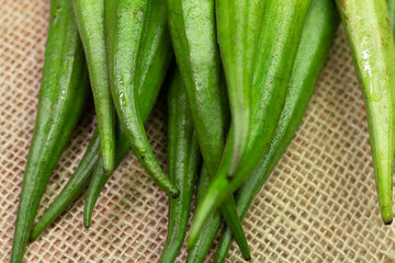 Okra piece on a white bowl on a table