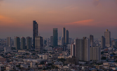 Naklejka na ściany i meble view of Bangkok City skyline twilight time, the business district of Bangkok the Capital of Thailand