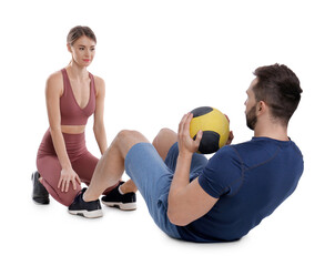 Fototapeta na wymiar Athletic couple doing exercise with medicine ball on white background