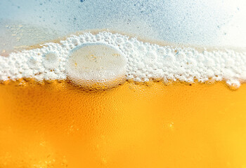 Glass with cold drink beer with condensation ice cool beverage background