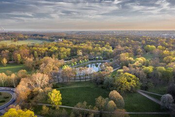 Fototapeta na wymiar Clara-Zetkin-Park in Spring Leipzig Germany Aerial Drone Shot - fresh green trees and a artificial Lake Park Garden Landscape