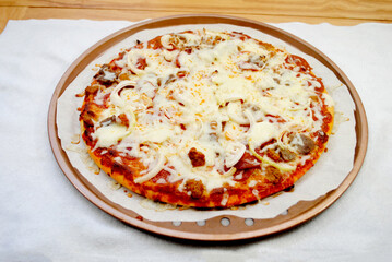 Hot Fresh Meat Lovers Pizza Pie with onions