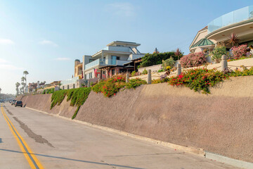 Pavement road with vehicles and double yellow lanes at Oceanside, California