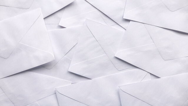A stack of white envelopes for background.
