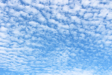 Fototapeta na wymiar Bright blue sky with white clouds