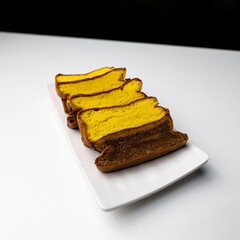 Spiku Surabaya,  is an Indonesian three layer rich sponge cake with yellow-chocolate cake with chocolate fla in between