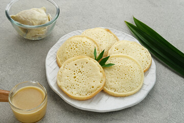 Serabi Durian, Indonesian pancake made of rice flour and coconut milk, served with durian sauce.
