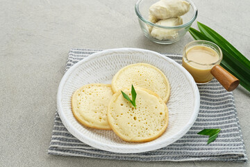 Serabi Durian, Indonesian pancake made of rice flour and coconut milk, served with durian sauce.
