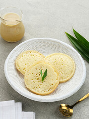 Serabi Durian, Indonesian pancake made of rice flour and coconut milk, served with durian sauce.
