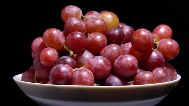 Fresh red grapes rotation background