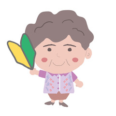 沖縄のかりゆしウェアを着た中年女性が初心者マークを持っている