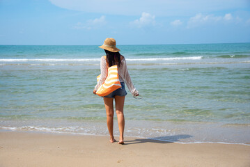 Happy traveler and tourism young women travel summer on the beach. relax outdoor destination leisure trip travel