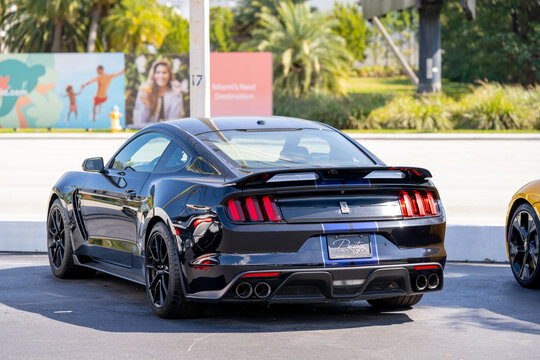 Miami, FL, USA - February 5, 2022: Photo of a black Ford Cobra GT 350 shot from the rear