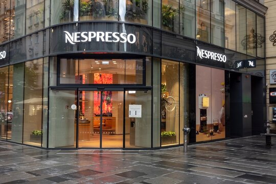 Storefront of Nespresso caffeteria  where people may drink coffee at evening